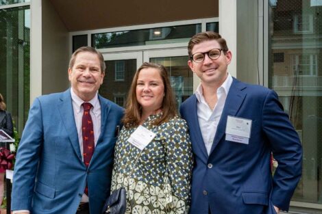 J. Peter Simon '75, Emily Simon Crystal '11 and Matthew Crystal '11 stand in front of the Simon Center for Economics and Business.