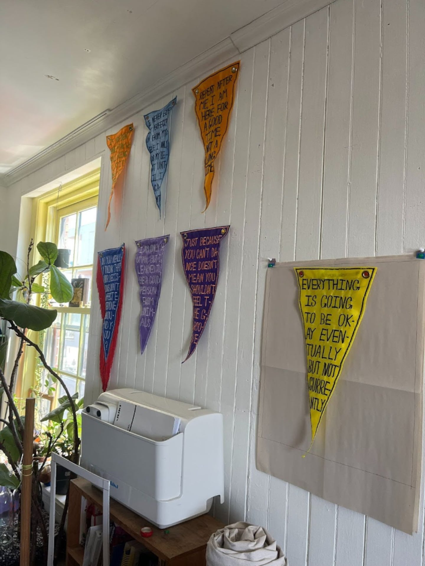 Andy Li creates embroidered pennants made from recycled marine fabric.