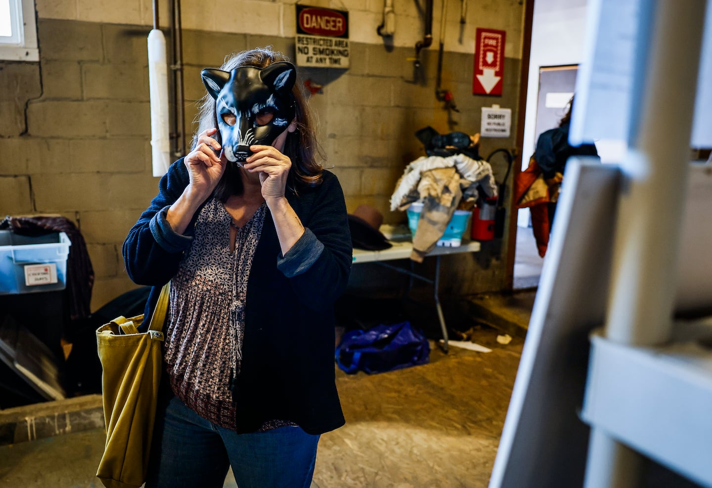 People tried on hats, costumes and masks costume sale Friday.