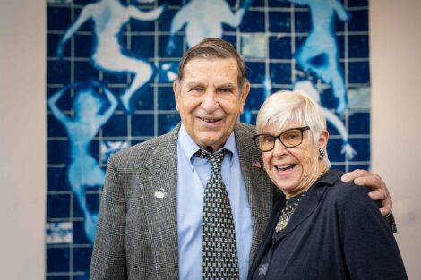 Al Siegel ’60 and Doll Siegel stand in the lobby of the new Simon Center for Economics and Business.