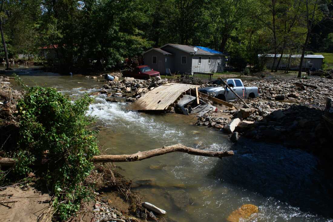 Damage to homes and vehicles along with evidence of re-routed streams can be seen on October 2, 2024 in Black Mountain, North Carolina. The road can be seen washed out from flood waters in front of his property. According to reports, at least 160 people have been killed across the southeastern U.S., and more than a million are without power due to the storm. The White House has approved disaster declarations in multiple southern states, freeing up federal emergency management money and resources.