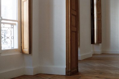 View of a historic Paris building that is empty. 