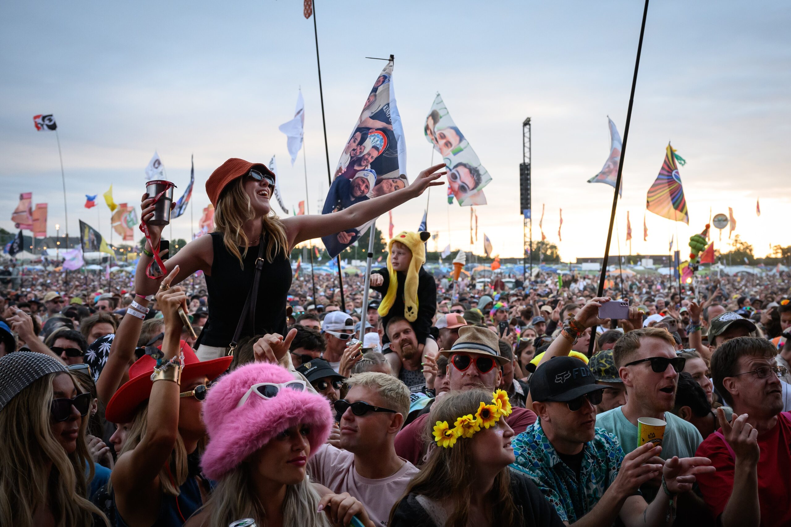 Fans dance at Glastonbury Festival 2024 at Worthy Farm