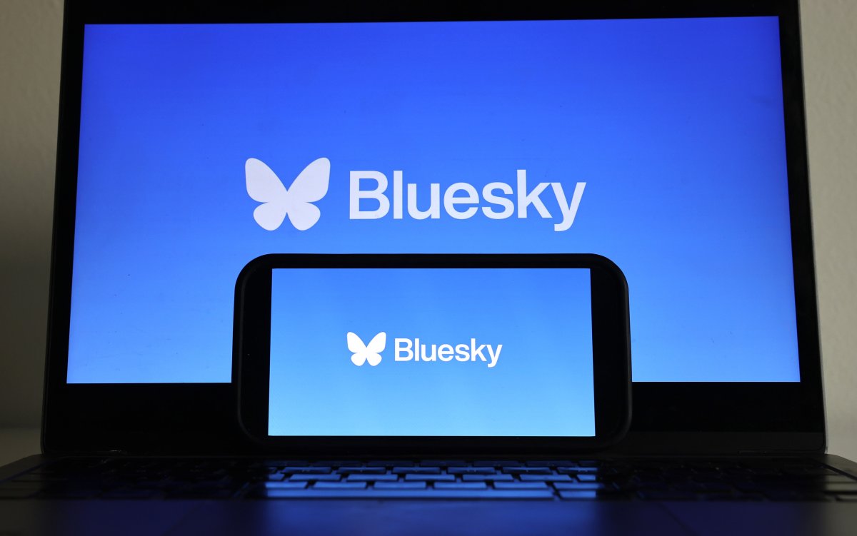 The Bluesky logo on a laptop, smartphone.