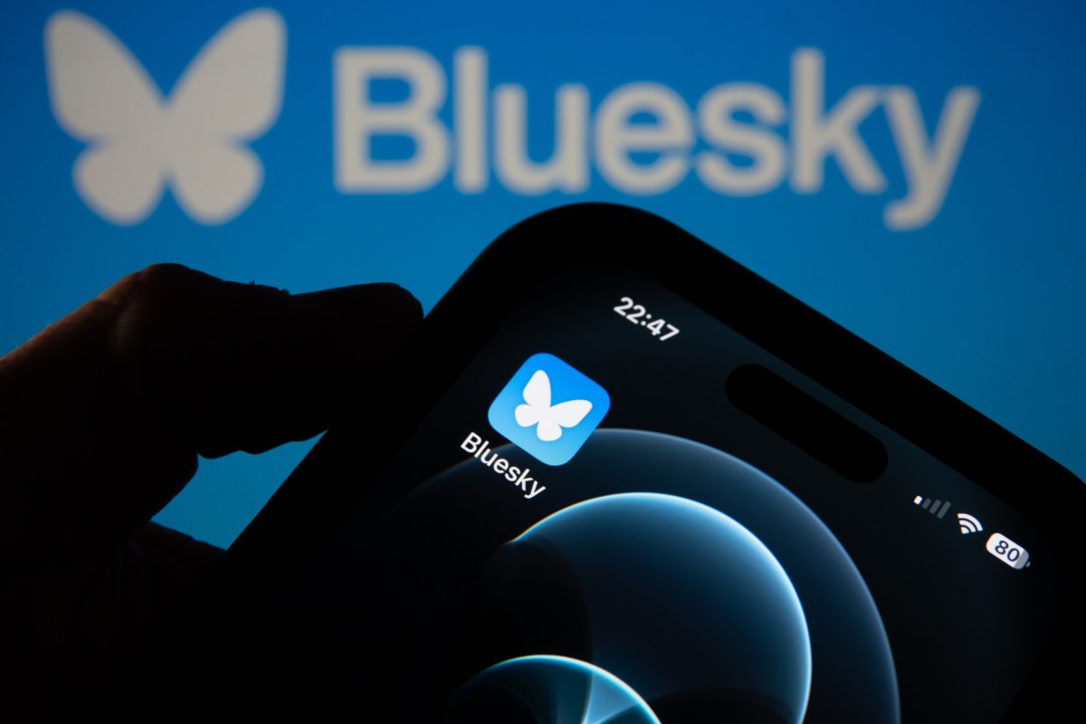 The Bluesky logo on a smartphone.