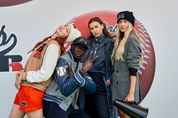 Gigi Hadid, TikTok performer Khaby Lame, Irina Shayk and German athlete Alica Schmidt at the Boss x Russell Athletic show, Milan Fashion Week. 