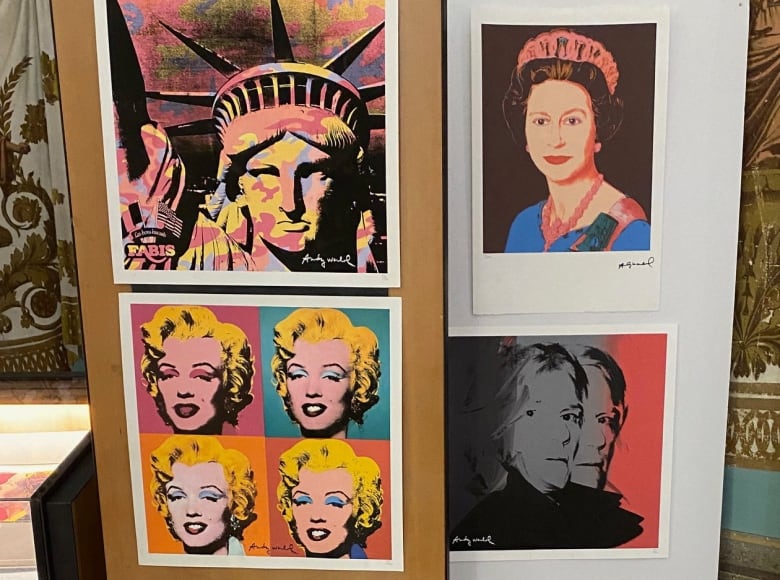 Colourful pieces of artwork are displayed. They appear to be prints in the style of Andy Warhol. 