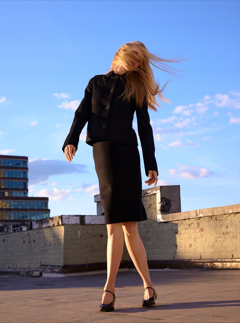 Nicole Kidman wearing a black jacket, black skirt and black shoes.