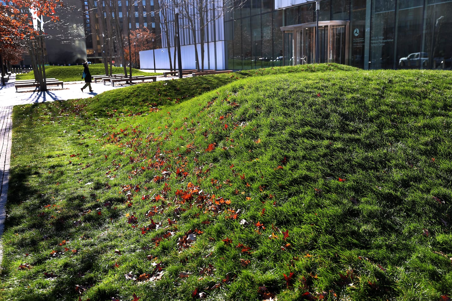 “The Sound we Travel at,” a landscape piece by artist Maya Lin, in Kendall Square. Visitors are invited to walk atop, or even sit on, the work.