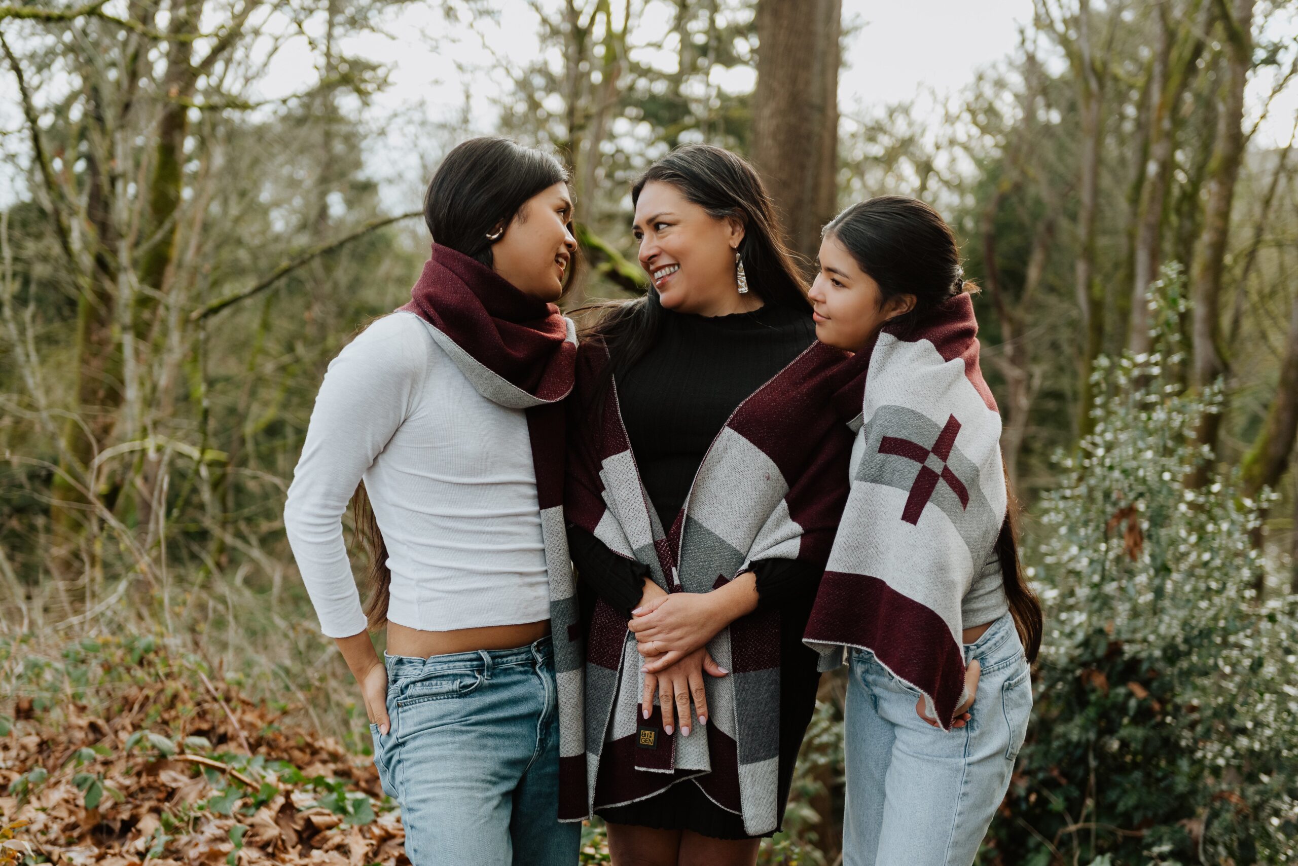 Colleen poses with her two daughters, True and Zoey, in Eighth Generation blankets.