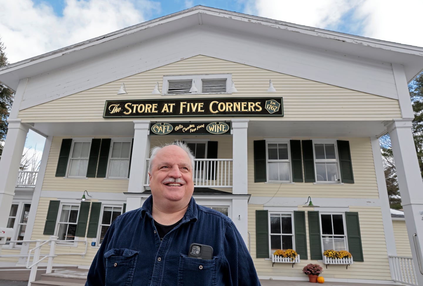 Matthew Baya posed in front of The Store at Five Corners in Williamstown. Baya led the initiative to bring Front Porch Forum to Williamstown four years ago.
