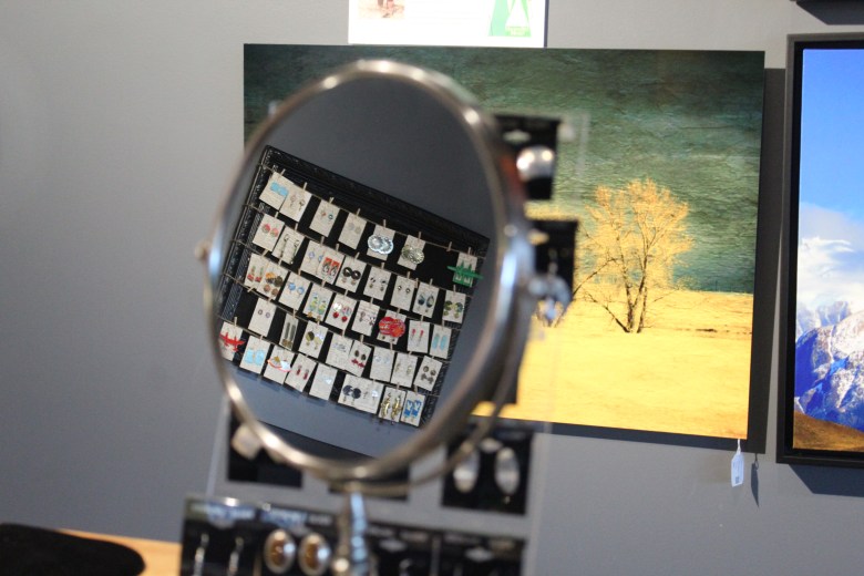 Pieces of jewelry are reflected in a mirror Dec. 3 Dec. 3 at the Foothills Art Center's 49th annual Holiday Art Market at its Astor House campus