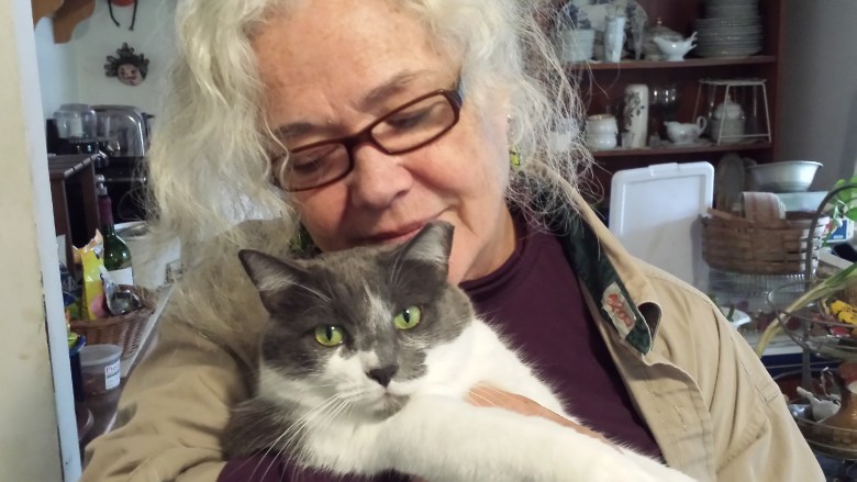 Kathleen Thompson with her beloved cat La Gata. Photo courtesy of Mike Nowak 