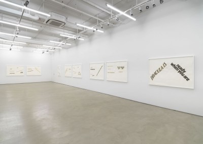 Collages hung on a wall. One prominent one reads 'Dracula is ready when you are' in two different fonts.