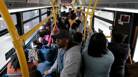 Getty Images Passengers ride the MBTA #1 bus in Boston