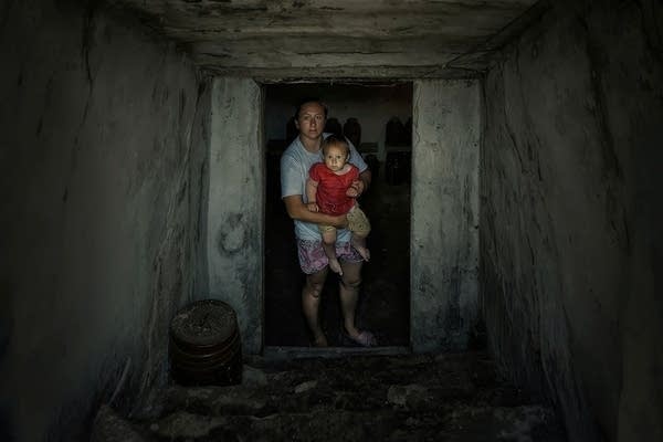 a woman carries her child