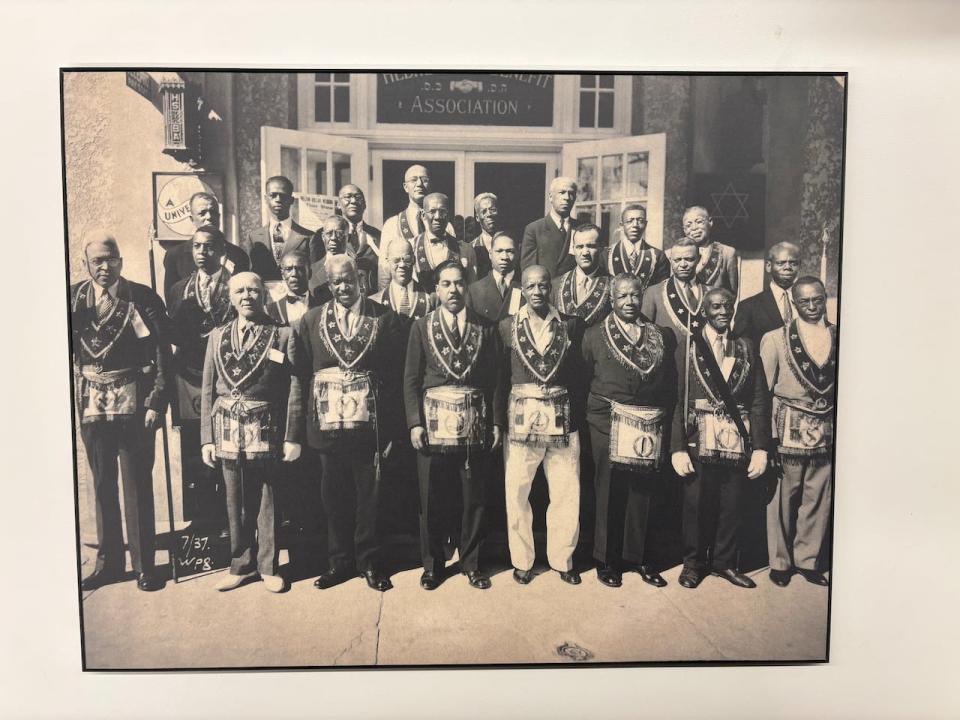 One of the photographs from the collection on loan from the Manitoba Museum, and featured in the exhibit dated July 1937 and shows members of the Menelik Lodge 528. Members are also referred to as the 'Black Elks' and ensured financial support for members who became ill, and death benefits for relatives of deceased members. 