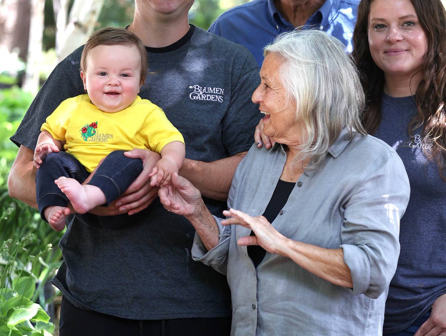 Joan Barczak, owner of Blumen Gardens, has some fun with her grandson Clay Mandeville Wednesday, June 19, 2024, at the store in Sycamore.