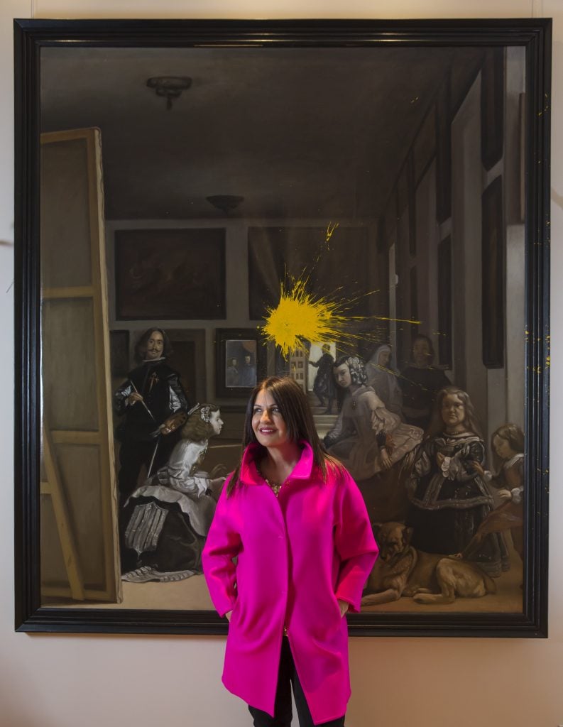 Basma Al Sulaiman stands in front of a painting in Madrid