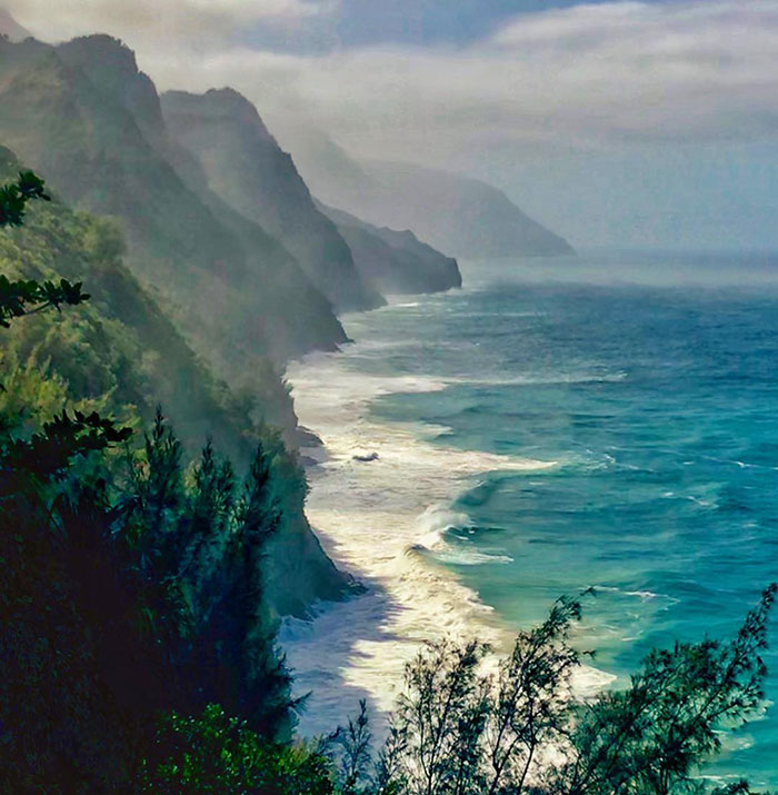 Coastal scene with misty cliffs and ocean waves; MySpace founder’s legacy remains influential.