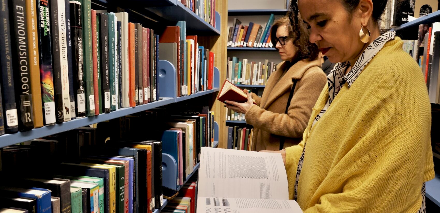 Adjoa Jones de Almeida and Jennifer Rice read books