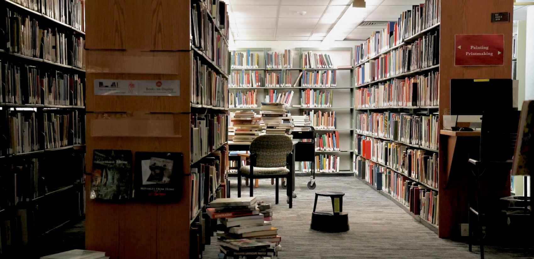 shelves of books and seats in the library