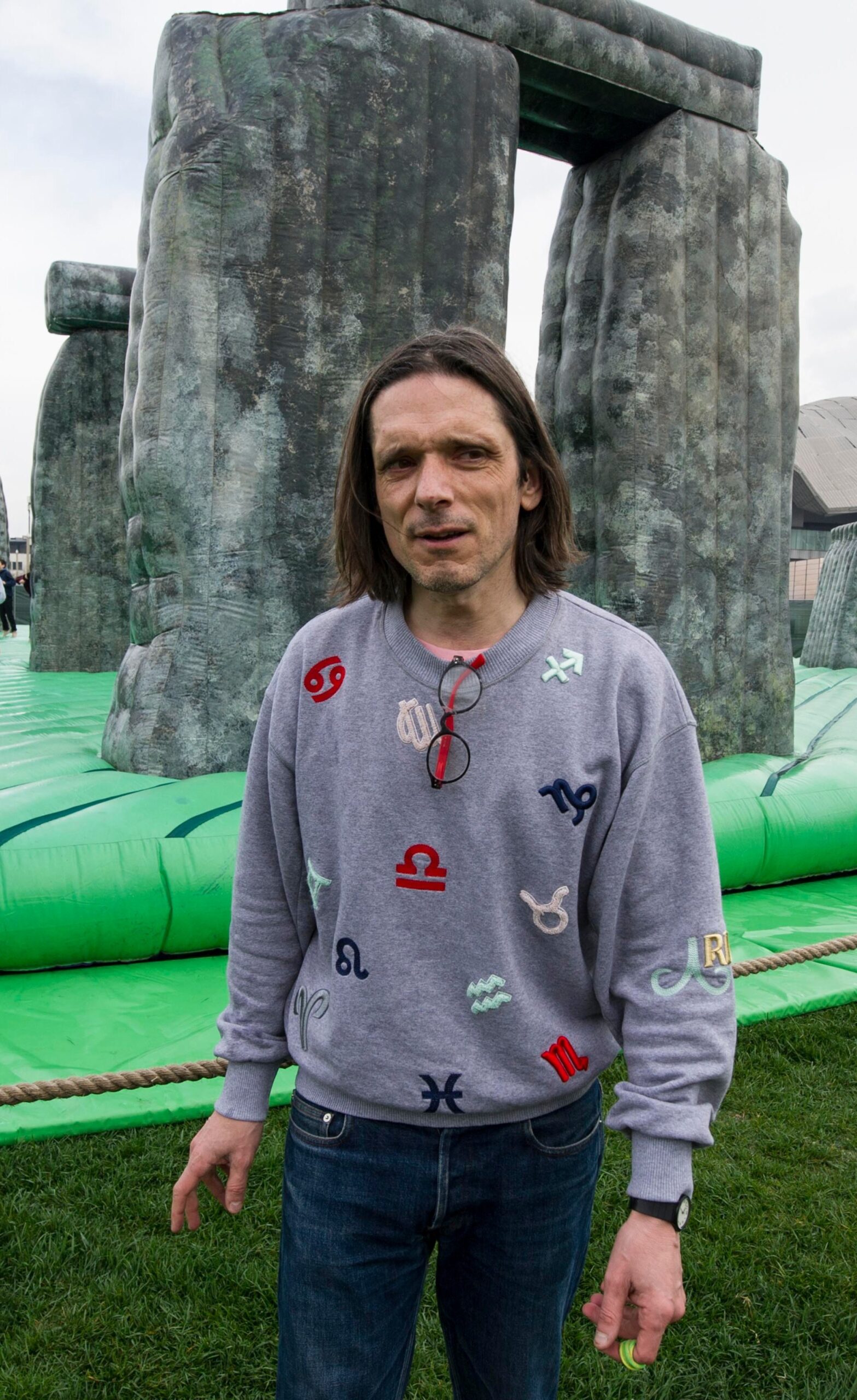 Jeremy Deller standing near his inflatable Stonehenge replica.