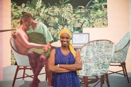 Njideka Akunyili Crosby in front of an artwork of a black couple sitting at a small table set with three chairs, embracing