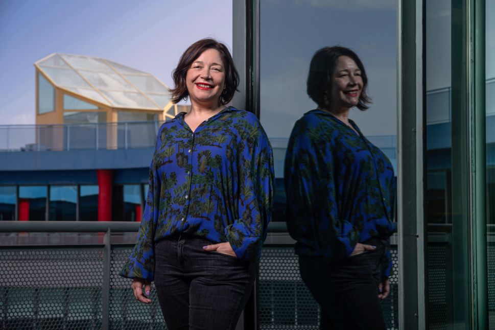 A woman smiling outside of an art fair