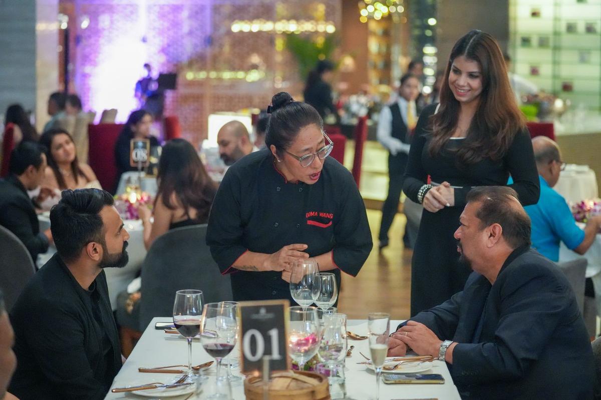 Chef Doma Wang with guests at ‘The Power Play’ dining experience last November. 