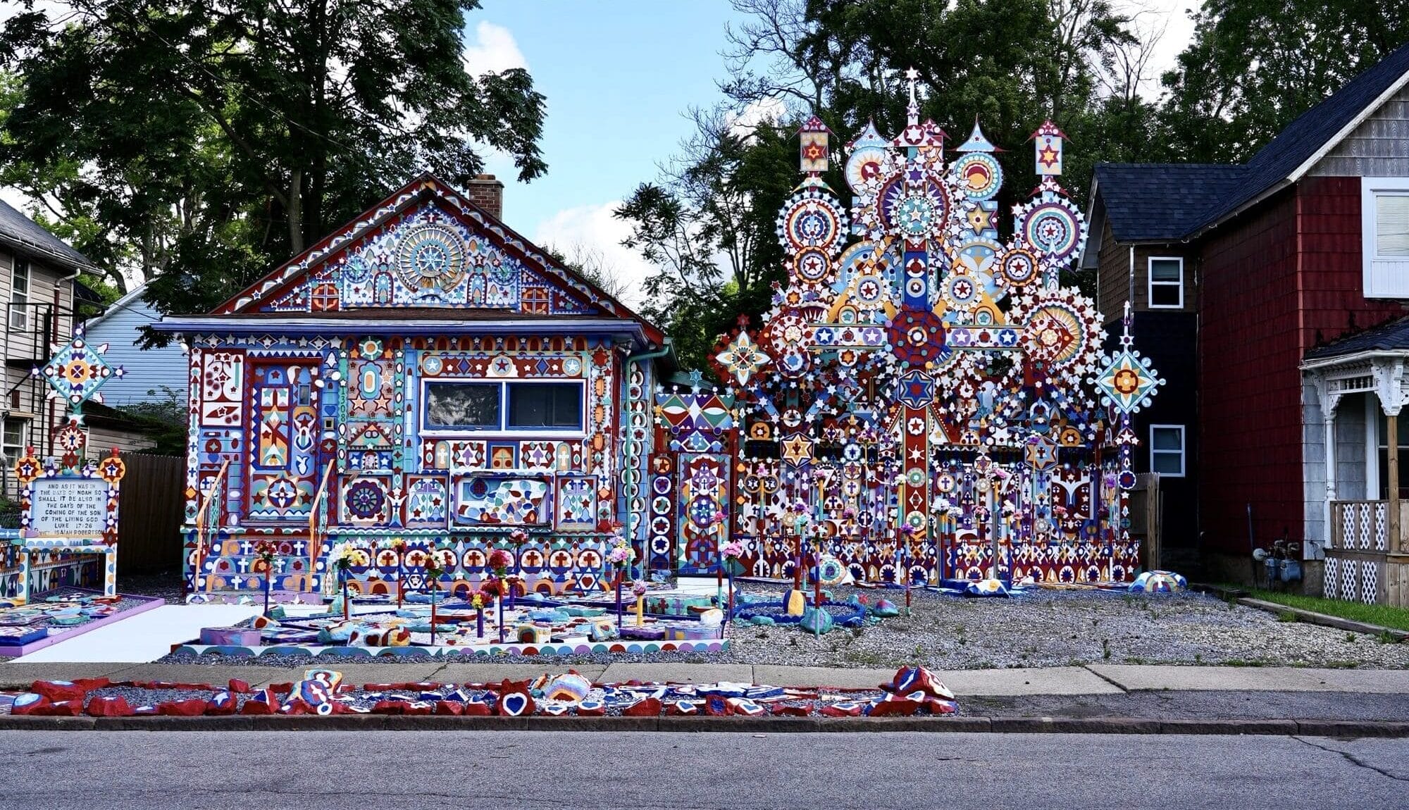 an extravagantly decorated house in New York, home to Prophet Isaiah Robertson, who turned the entire structure into an artwork in myriad colors with large pinwheel-like sculptures and paintings