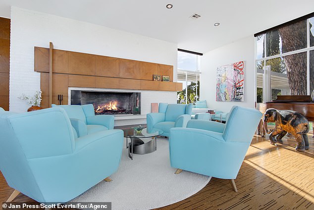 Deluxe finishes include a bar and a large chef's kitchen. The house is also decked out with state-of-the-art appliances and a handful of fireplaces