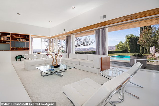 The mansion is perched on a hilltop with 360-degree views over LA, the mountains, and the surrounding 3,000 acres of nature preserve