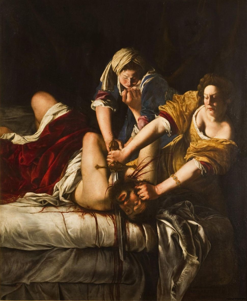 A dramatic painting shows two women holding down a man on a bed while one of them decapitates him with a sword, with blood pouring onto the sheets.