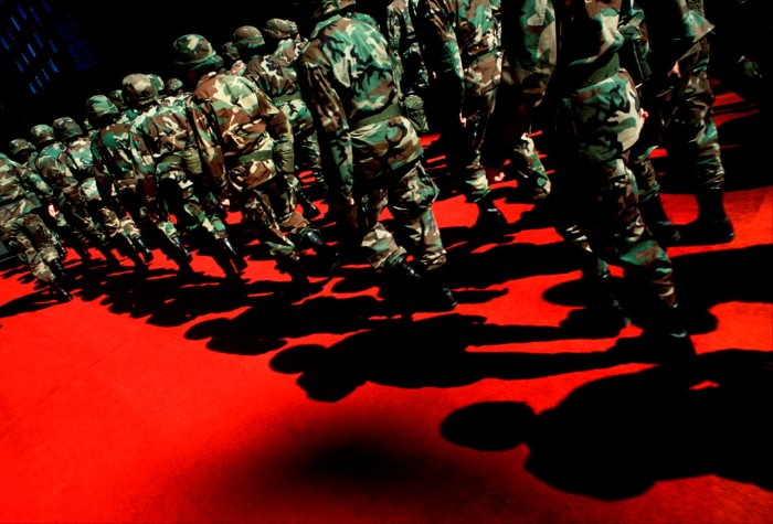 A platoon of soliders on a red carpet