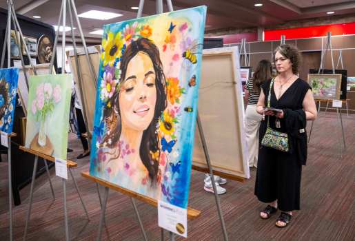 More than 100 artists, their guests and Med Center employees attended the kickoff reception of the 33rd Annual Med Center Health’s Women in the Arts Exhibit Thursday, March 13, 2025 at the The Medical Center-WKU Health Sciences Complex. Winners were announced and awards were handed out during the event. The art exhibit is scheduled for Friday, March 14 and Saturday, March 15 at The Medical Center-WKU Health Sciences Complex. According to Med Center Health, the event provides female artists with an opportunity to showcase their work. The exhibit is open to any female artist over 18 years old residing in Kentucky. Artists may enter their artwork in the following categories: painting, sculpture, ceramics, works on paper, fiber works and photography. Awards include Special Purchase, Cash Merit, Honorable Mention, and ArtWorks Award. The exhibition committee and a juror will select the 2025 Special Purchase Award piece which will be purchased by and displayed at The Medical Center. (Daily News photo by Joe Imel)