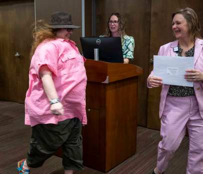 Misha Ambrosia (left) receives an award from Katrina Wood, Vice President and Chief Nursing Officer. More than 100 artists, their guests and Med Center employees attended the kickoff reception of the 33rd Annual Med Center Health’s Women in the Arts Exhibit Thursday, March 13, 2025 at the The Medical Center-WKU Health Sciences Complex. Winners were announced and awards were handed out during the event. The art exhibit is scheduled for Friday, March 14 and Saturday, March 15 at The Medical Center-WKU Health Sciences Complex. According to Med Center Health, the event provides female artists with an opportunity to showcase their work. The exhibit is open to any female artist over 18 years old residing in Kentucky. Artists may enter their artwork in the following categories: painting, sculpture, ceramics, works on paper, fiber works and photography. Awards include Special Purchase, Cash Merit, Honorable Mention, and ArtWorks Award. The exhibition committee and a juror will select the 2025 Special Purchase Award piece which will be purchased by and displayed at The Medical Center. (Daily News photo by Joe Imel)