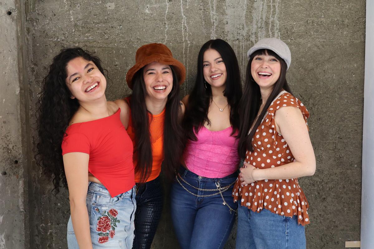 Four women smiling