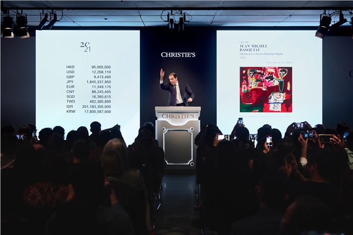 Auctioneer Adrien Meyer selling Jean-Michel Basquiat’s Sabado por la Noche during Christie’s 20th/21st Century Evening Sale in Hong Kong on March 28th, 2025.