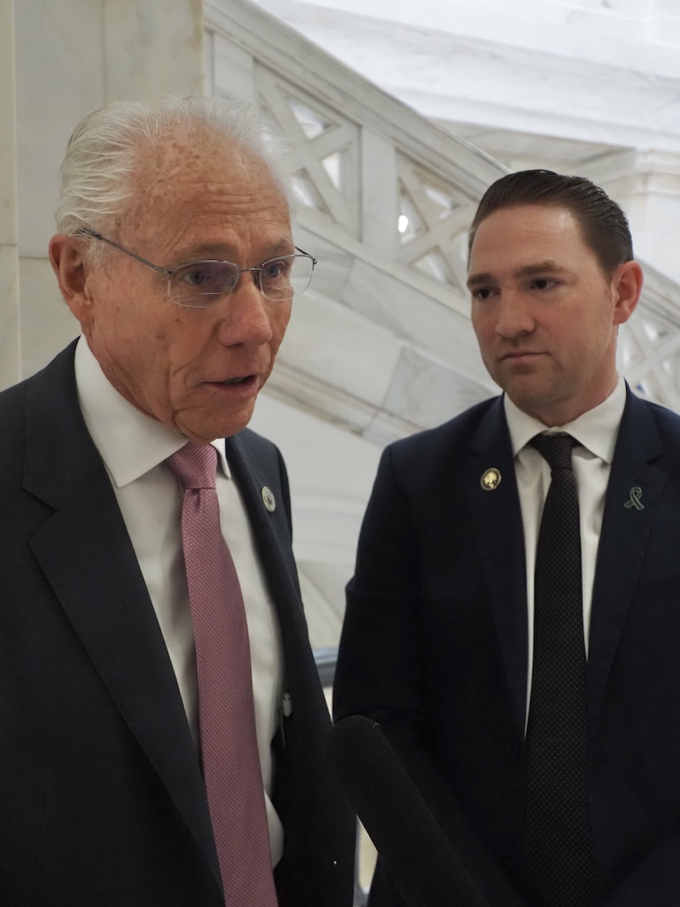 Rep. Jon Eubanks of Paris (left) and Sen. Tyler Dees of Siloam Springs, both Republicans, talk to reporters in the Arkansas Capitol on Jan. 29, 2025.