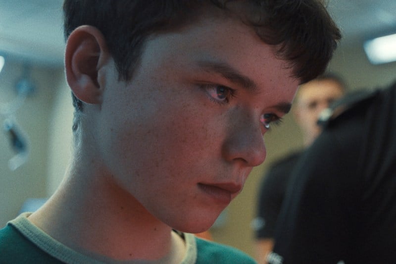 A closeup image of a teenage boy's face.