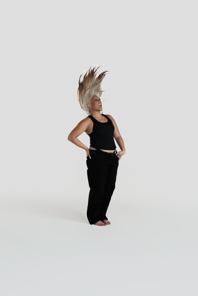 A dancer flipping her hair up.