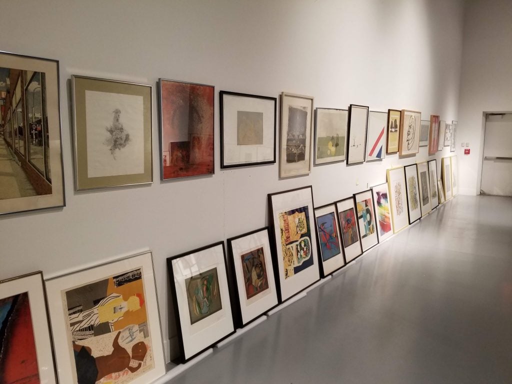 Artworks hang in a gallery