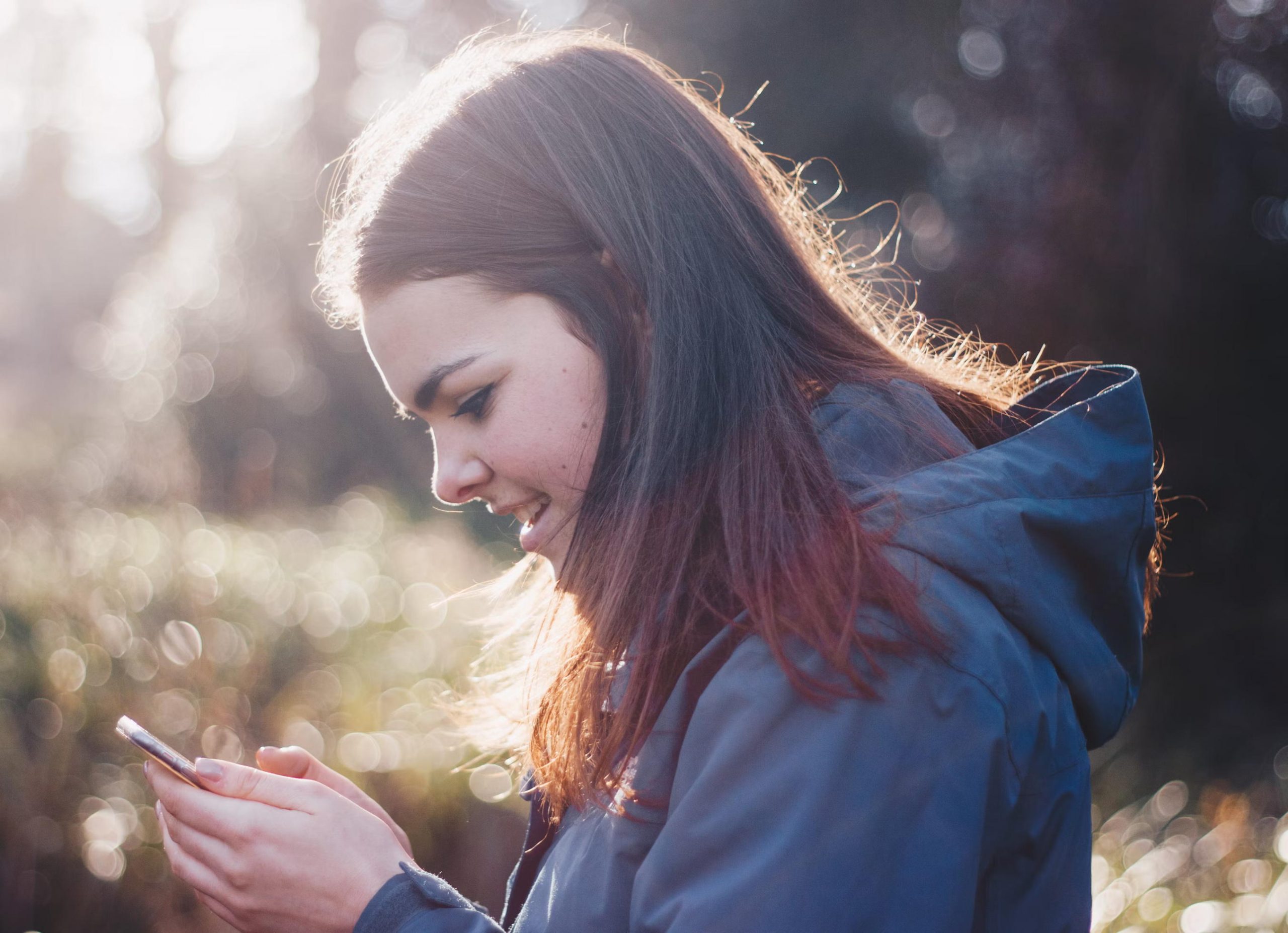 child smartphone tablet children Image credit Unsplash 004 A young user looks at a smartphone. Children, youth, social media.