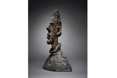 A jagged bronze bust of a man.