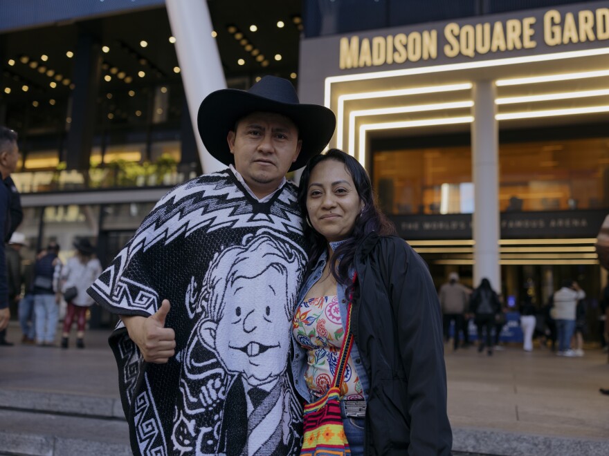 Yobani Escandon Galvan, left, and Rosalina Maldonado, center, stand for a portrait outside of Madison Square Garden before the start of the Sinaloa, Mexico band, Los Tigres del Norte show at Madison Square Garden.