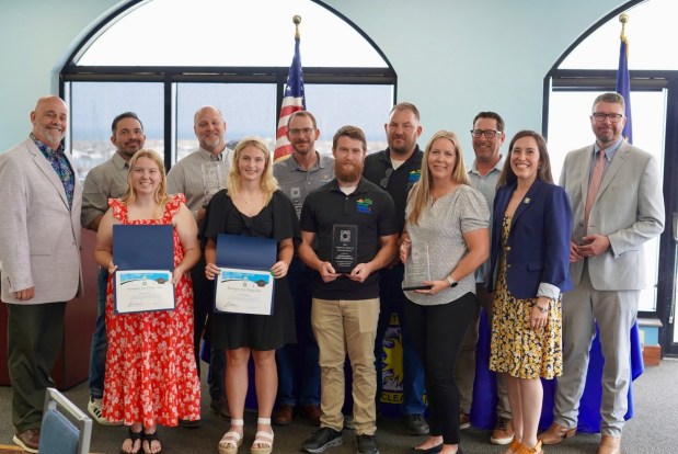 Northwest Indiana Partners for Clean Air presented awards to air quality leaders recently at its annual luncheon. Pictured are, front row, from left, Brooke Lakin, Michigan City High School; Kaitlin Shideler, Valparaiso High School; Jake McEvoy, Porter County Parks & Recreation; Leanne Balkema, K&C Trucking Co. Inc.; Malorie Medellin, IDEM & PCA Coordinator. Back row, from left, Scott Nelson, Cheneco & PCA Chairperson; Andrew Kenealy, Metro Ports; Peter Clevering, Homewood Disposal; Jeremy Sobecki, La Porte County; Bryan Waisanen, Porter County Parks & Recreation; Scott Balkema, K&C Trucking Co.Inc.; IDEM Commissioner Clint Woods. (Photo courtesy of IDEM)