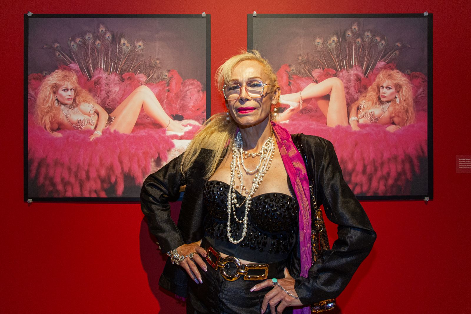 Artist Antonella Rubens in front of her portraits at the opening reception.